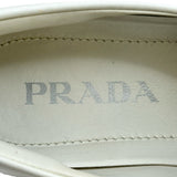 プラダ PRADA モノリス トライアングルロゴローファー ホワイト レザー レディース ローファー